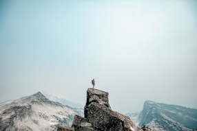 a person standing on top of a mountain