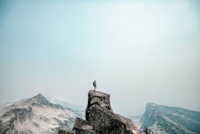 a person standing on top of a mountain