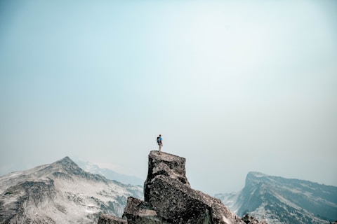 a person standing on top of a mountain