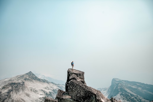 a person standing on top of a mountain