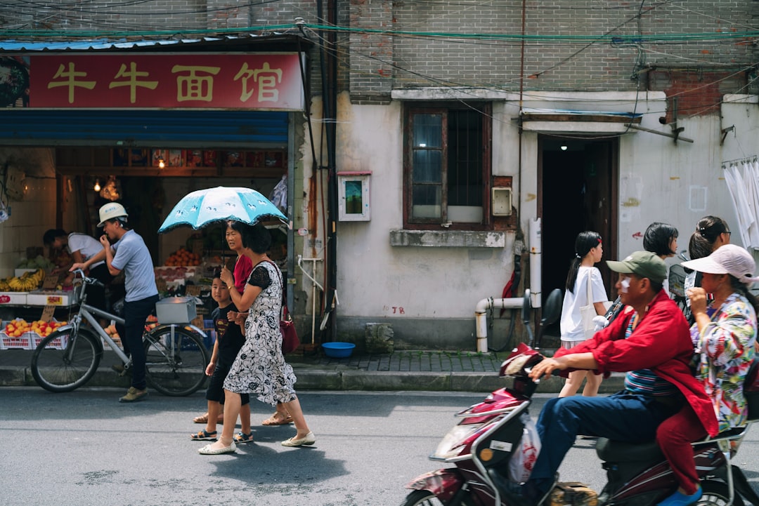 group of people on street, Hutong in Shanghai