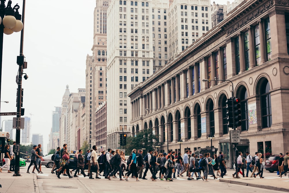 people crossing on road during daytime