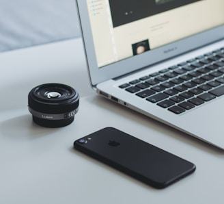 black iPhone 7 and MacBook Air