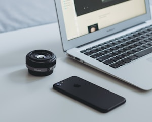 Minimalist desk setup with camera and design tools.