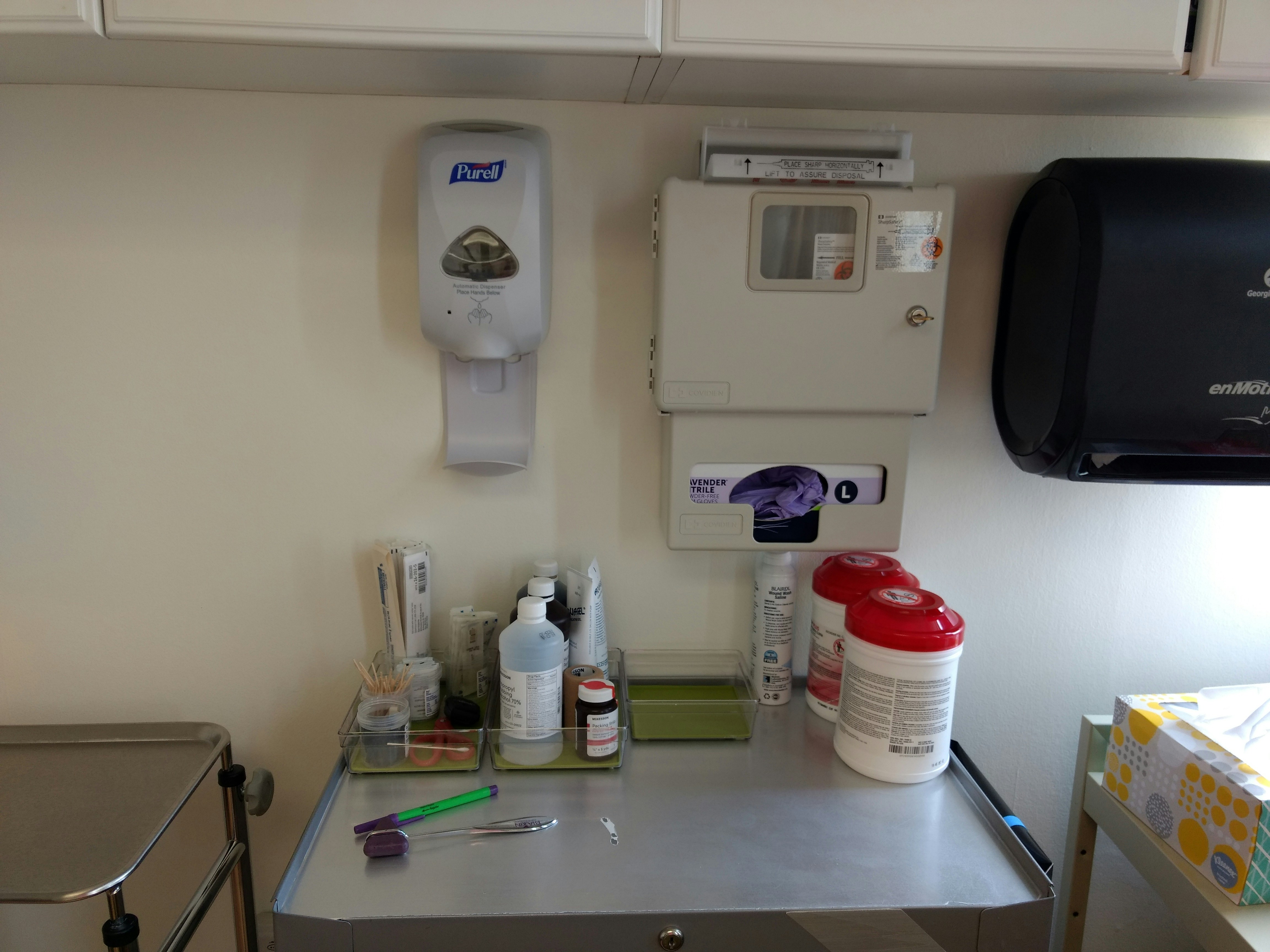 Neatly organized emergency supplies laid out on a clean table in bright natural light