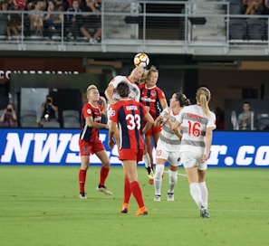 An intense sports match with athletes in mid-action on the field.