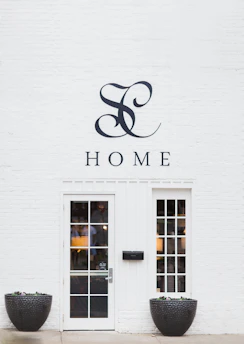 Elegant acrylic house name plate displayed on a modern home entrance.