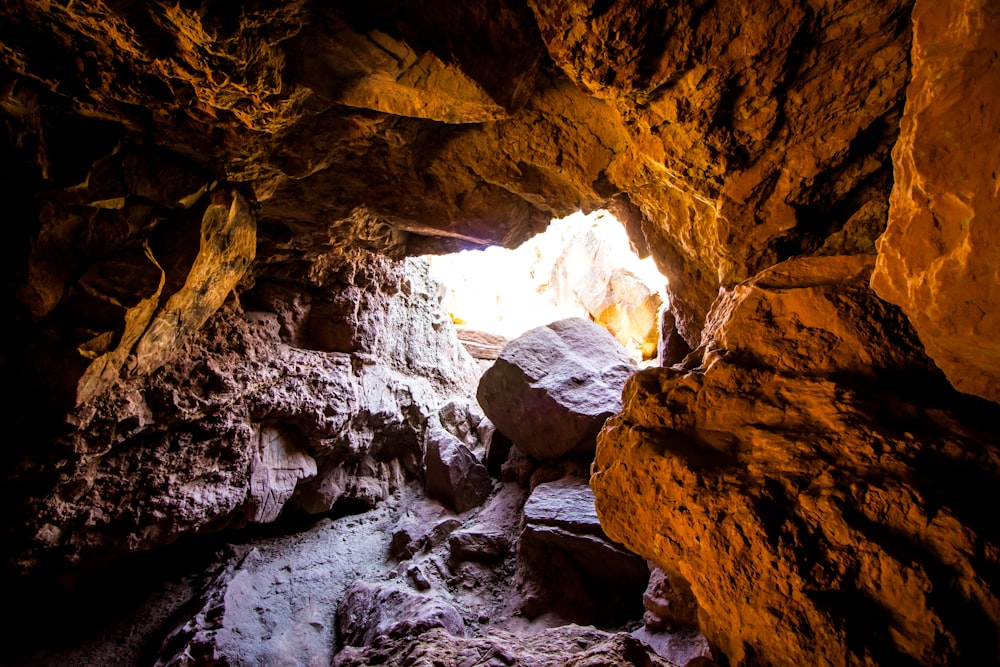 a cave with a small opening in the middle of it