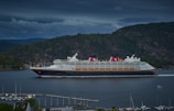 white and gray ship on body of water