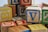 A pile of wooden alphabet blocks featuring various letters in different colors including red, blue, yellow, and green. The blocks appear well-worn, suggesting they have been frequently used or are vintage.