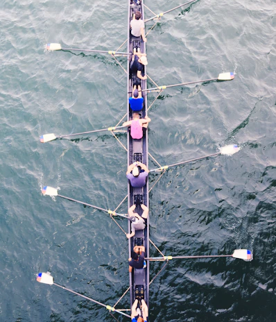 Athletes practicing synchronized swimming moves, demonstrating teamwork and grace in the water.