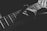 grayscale photo of person holding guitar neck and strings