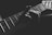grayscale photo of person holding guitar neck and strings