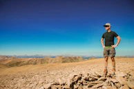Outdoor hiker wearing the exoskeleton trail model, walking confidently on a mountain path.