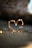 close-up photography of heart shaped fairy lite on brown sand