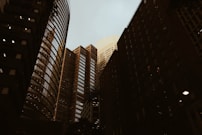 a couple of tall buildings sitting next to each other