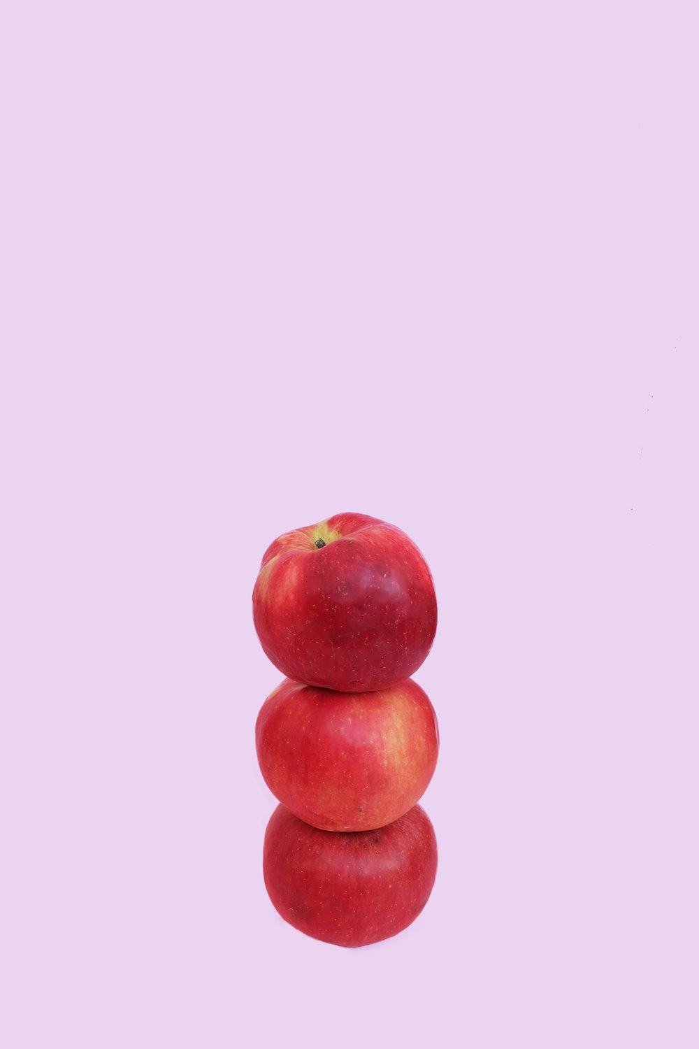 three overlapping honeycrisp apples