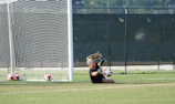 Action shot of a soccer player diving, protected by Fortiguard shin guards.
