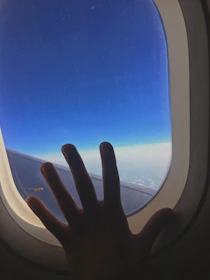 A dynamic photo of a pilot’s hand smoothly adjusting the throttle against a bright blue sky.