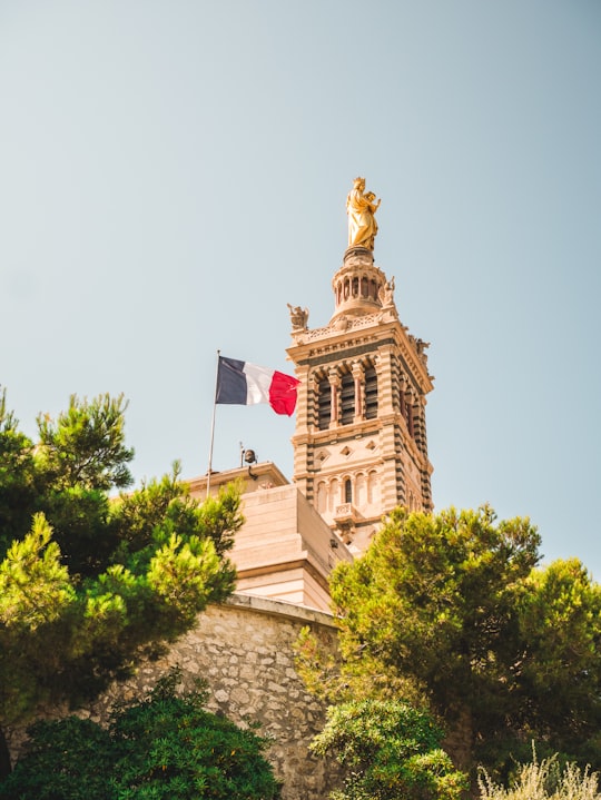 flag of France on high rise building in Basilique Notre-Dame de la Garde France