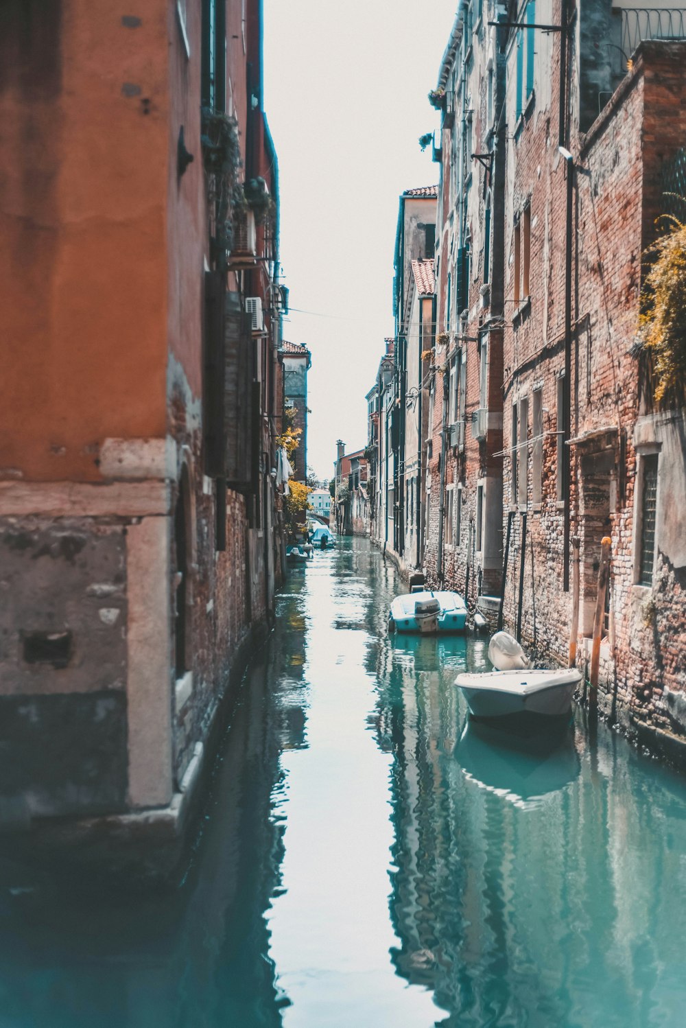 water stream surrounded with concrete houses