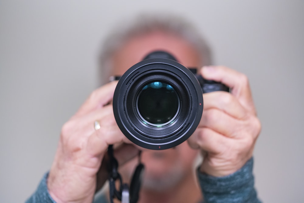 person holding digital camera