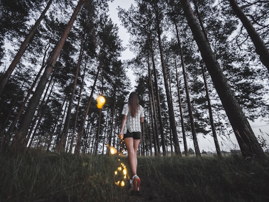 woman walking in forest in Ivanovo Russia