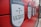 A red wall displays several black and white shield-shaped plaques with labels and dates. The foreground plaque reads '-7 VÁZQUEZ 2017' and mentions 'MLS BEST XI'. Other plaques highlight records and player achievements.