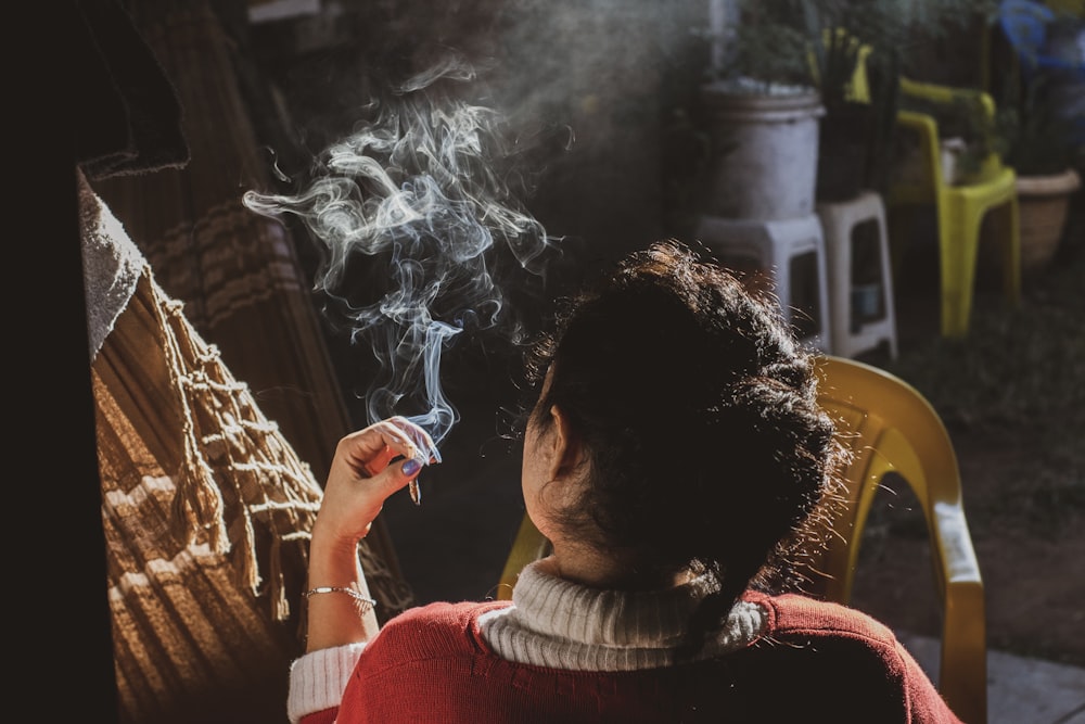 woman holding cigarette