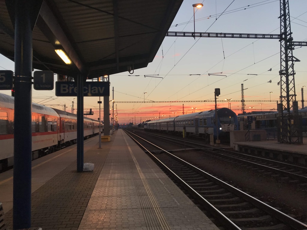 Empty train station during golden hour. Photo by Victor Li