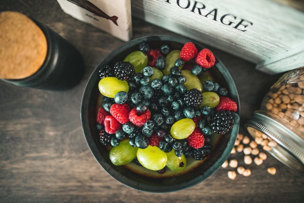 assorted fruits on gray metal bowl