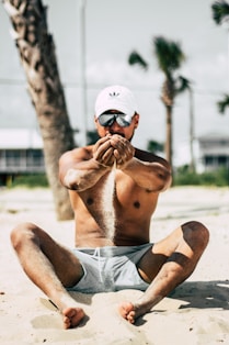 man pouring sands