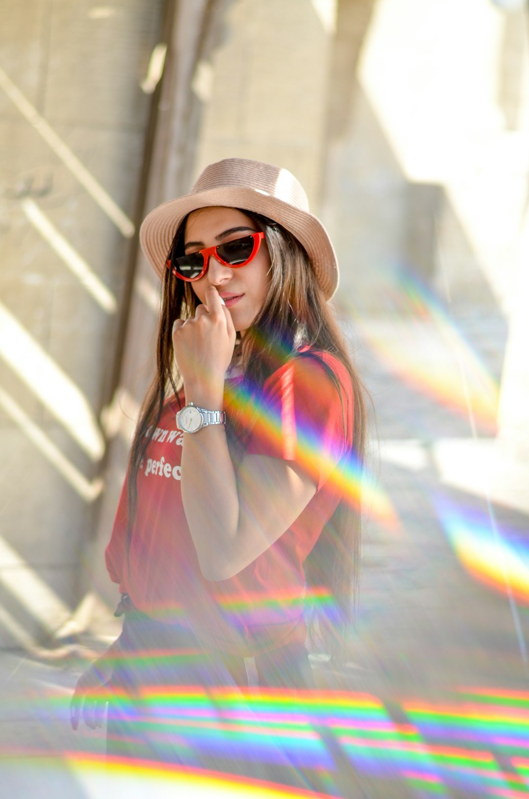 woman standing outdoor while touching her lips