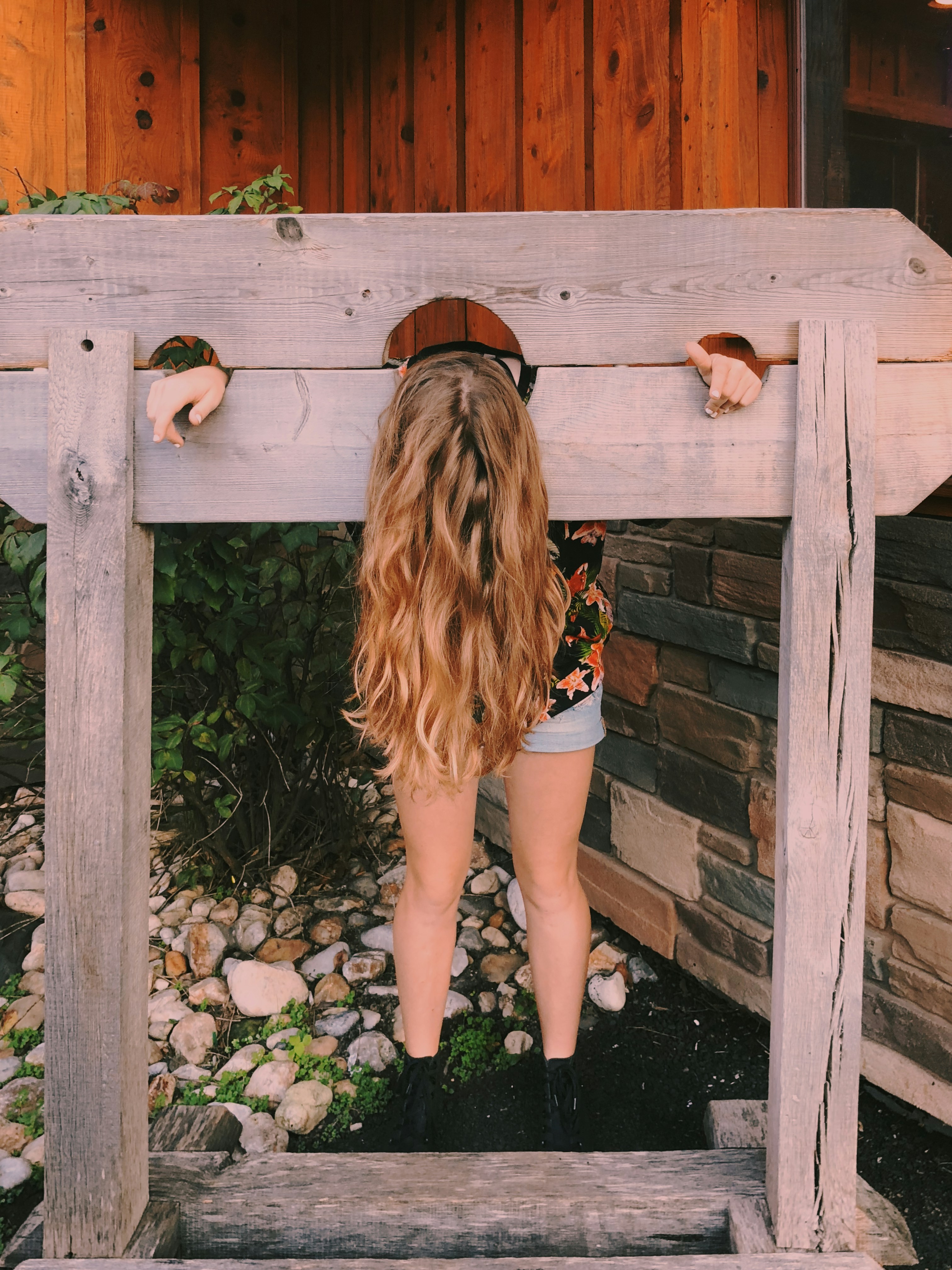 woman putting head on plank