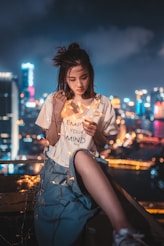woman holding star-themed string lights onlyfans