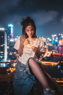 woman holding star-themed string lights onlyfans