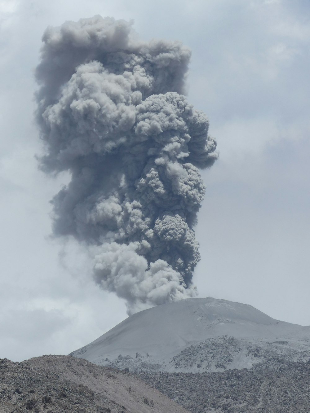 volcano under cloudy sky during daytime