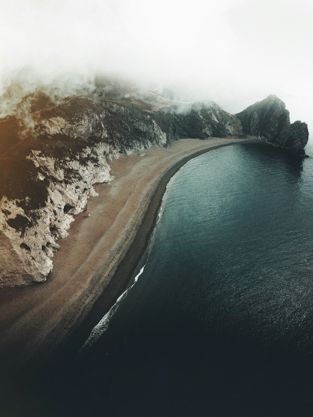 aerial photography of body of water and seashore