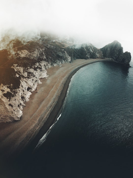 aerial photography of body of water and seashore in Jurassic Coast United Kingdom