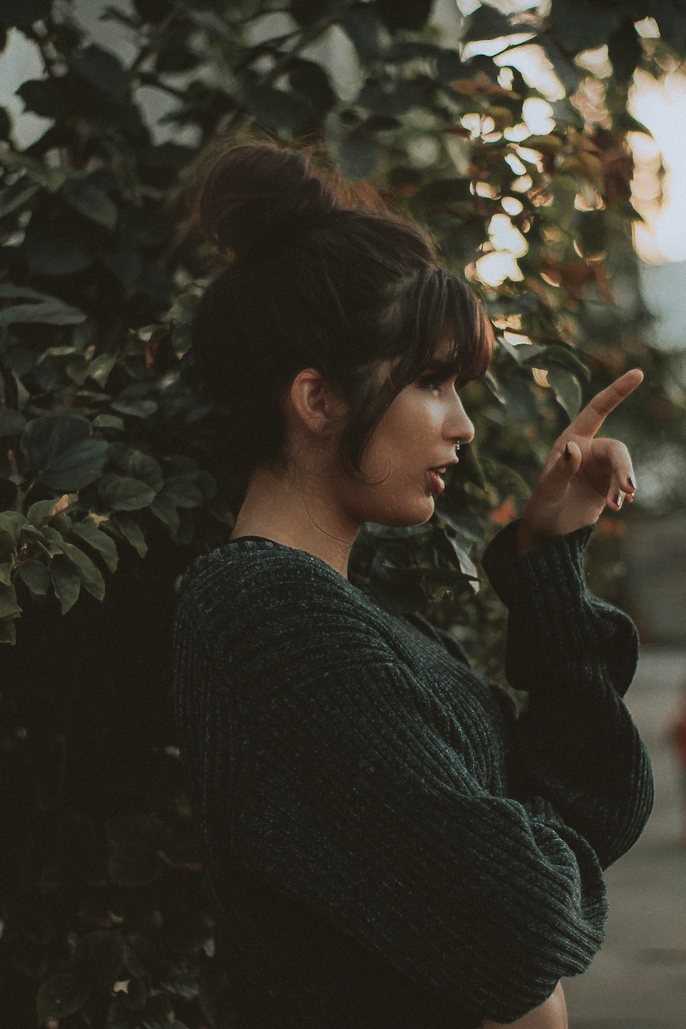 woman standing beside tree