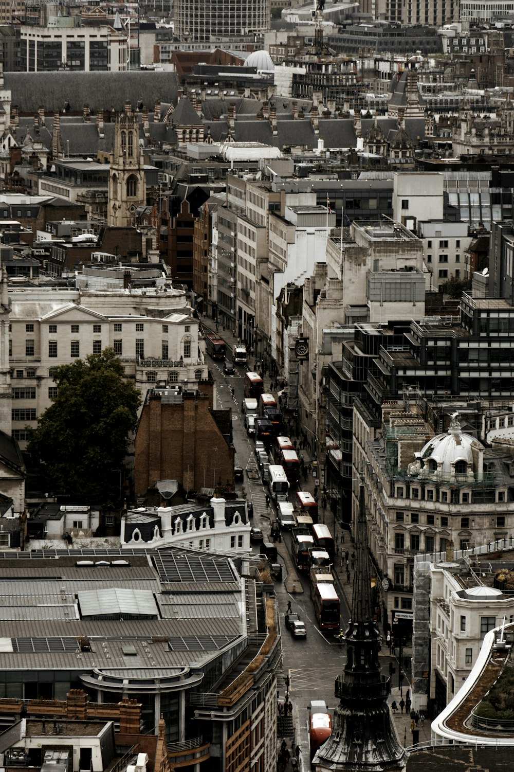 road filled with vehicles in between structures