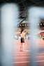 woman standing holding baton