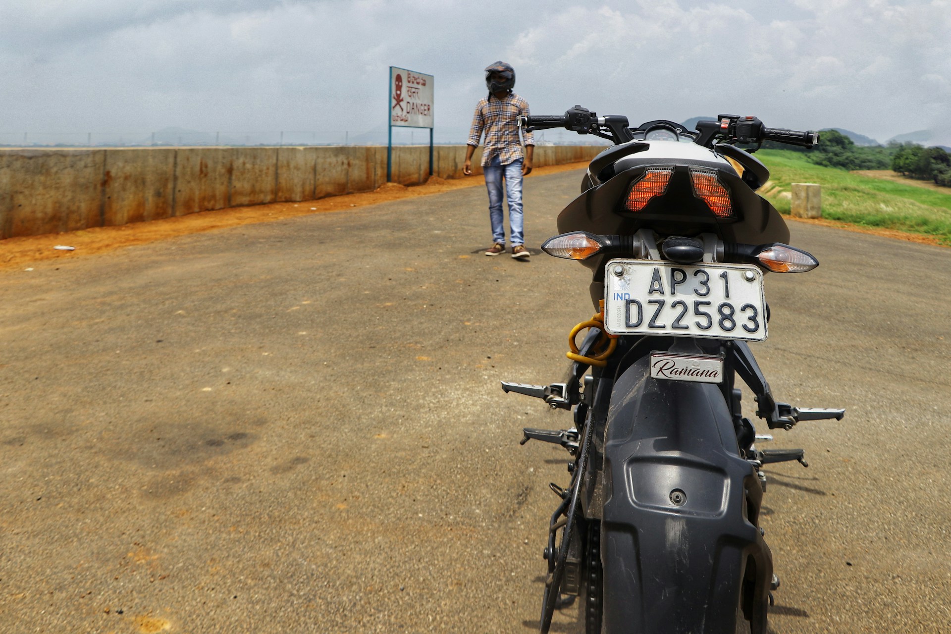 woman wearing yellow long-sleeved dress under white clouds and blue sky during daytime
