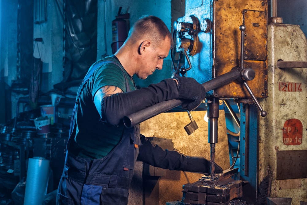 brass-colored manual drill press