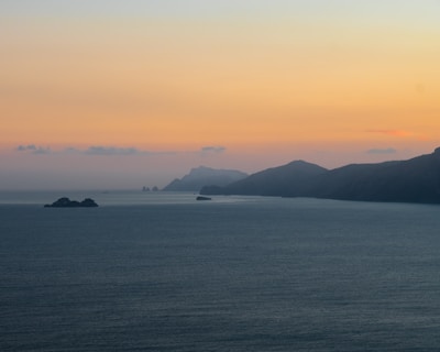 A serene coastal sunset from one of the leisure travel packages offered by c travel & events.