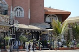 A detailed exterior view of a luxurious house showcasing intricate architectural features.