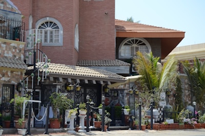 A detailed exterior view of a luxurious house showcasing intricate architectural features.