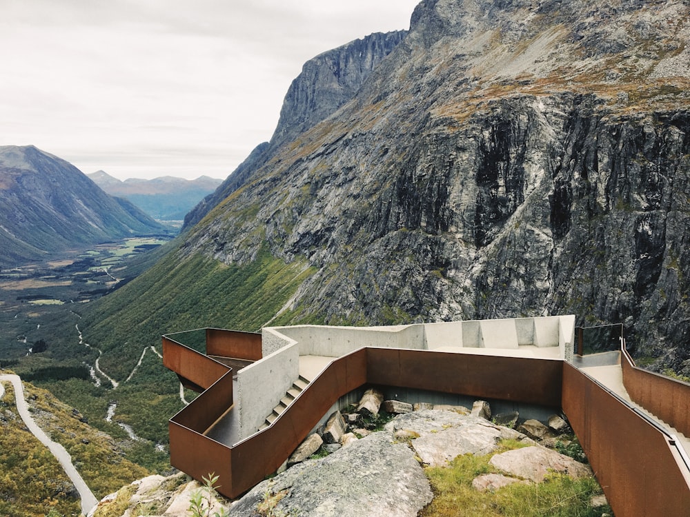 white and brown structure near mountain