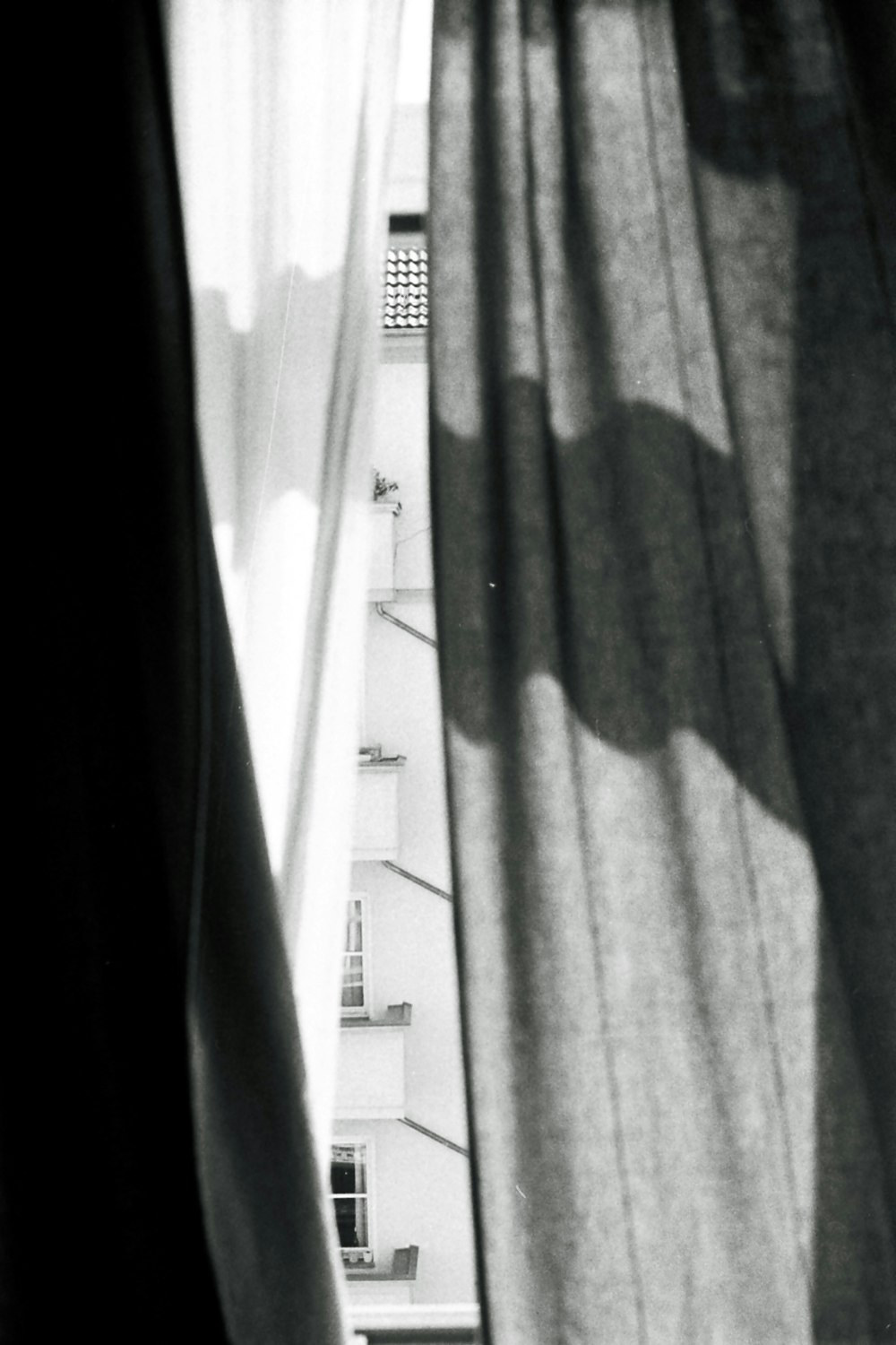 three white, gray, and black panel curtains