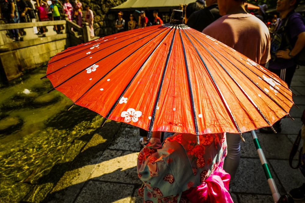 girl wearing kimono holding umbrella